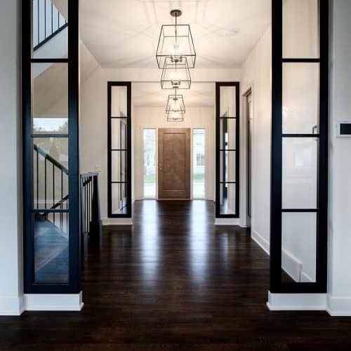 Dark hardwood floors complement light-colored walls for a sophisticated interior look.