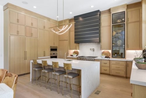 Modern organic kitchen with european white oak flooring and wood cabinetry.