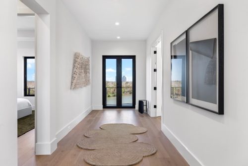 Serene entryway featuring modern decor and natural accents.