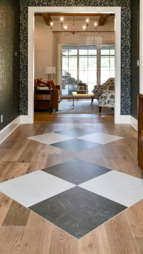 Black and white diamond inlay paired with european white oak flooring.
