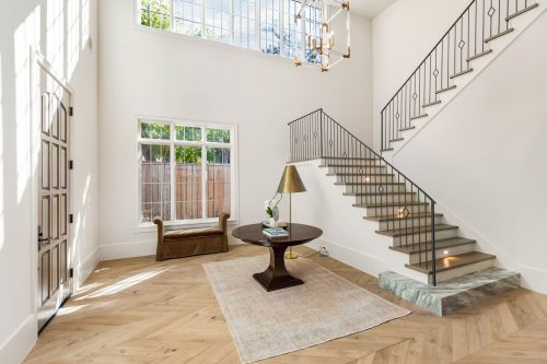 Dramatic entryway with chevron European white oak flooring.