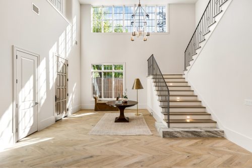 Vintage Loft Bowery installed in light-filled Houston home entryway.