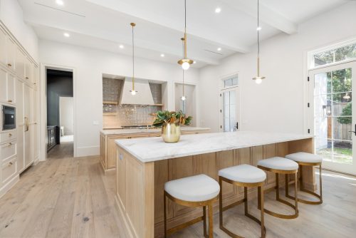 Organic luxe kitchen with warm color palette and gold accents.