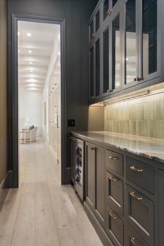 Dark moody pantry with light tan european white oak flooring.
