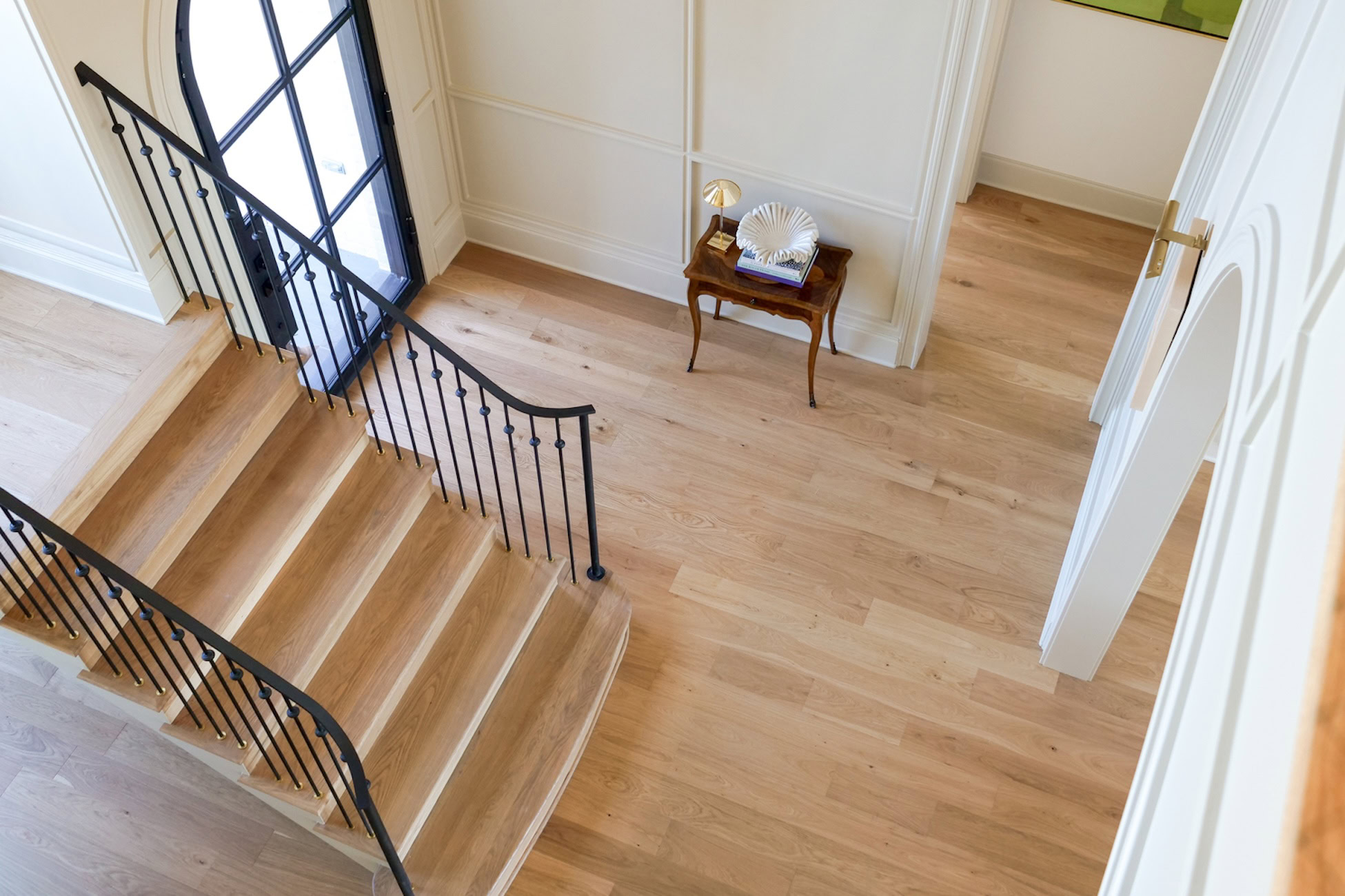 Collierville home entryway with paneled walls and natural wood floors creating depth and dimension