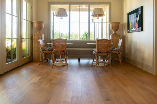Sunlit dining nook with 1875 Putney hardwood flooring and natural textures