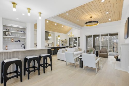 Open concept living room and kitchen featuring Silvian Laakso-Valley hardwood flooring in the Williams Naylor residence featured as Axios Charlotte’s Home of the Year.