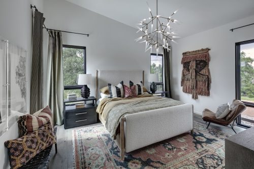 Bedroom with wood flooring, soft neutral tones, and natural textures creating a calm, nature-inspired retreat
