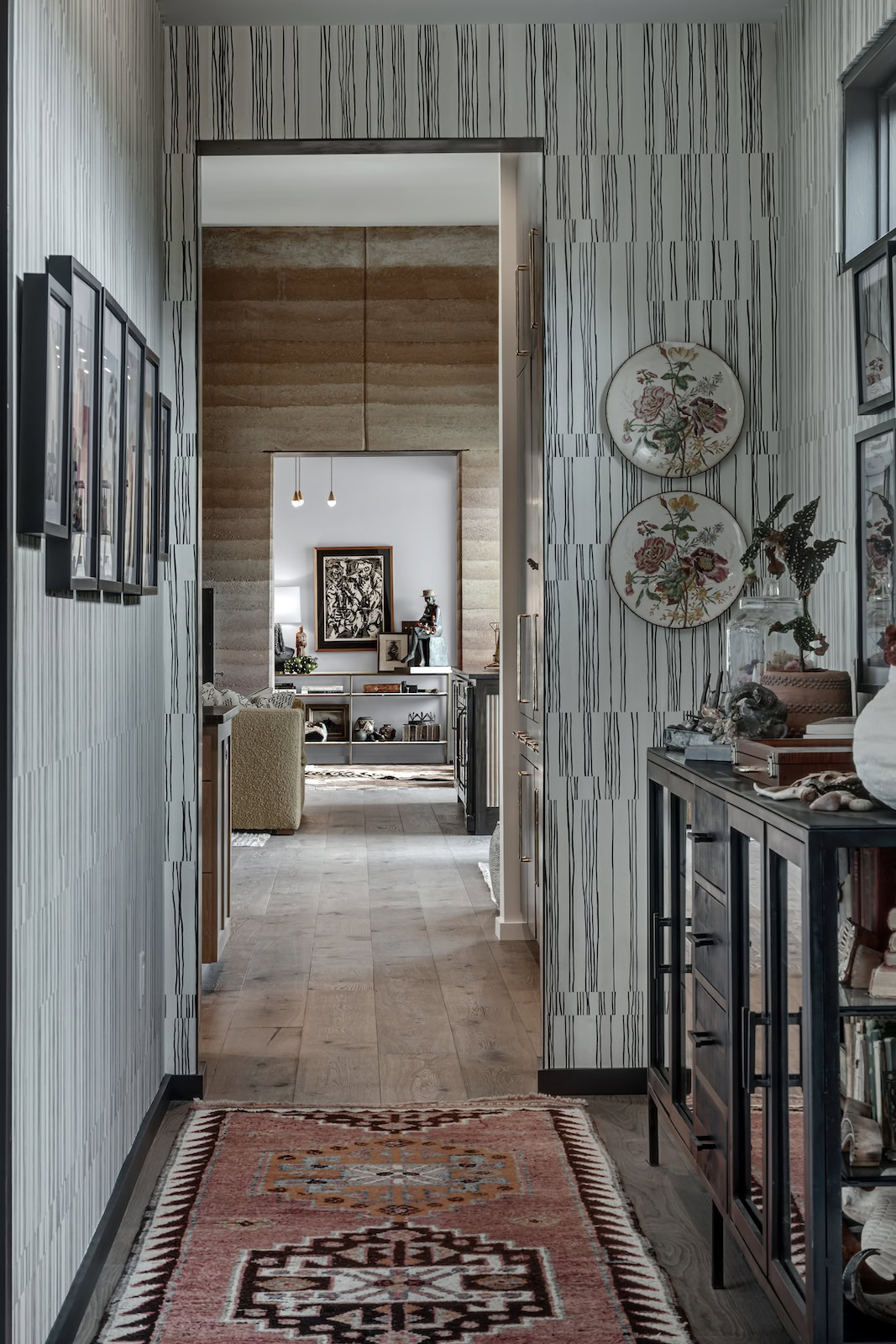 Light-filled entryway featuring wood flooring and layered textures for a warm, grounded transition space