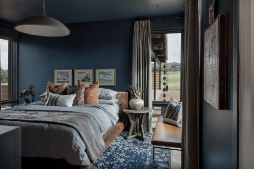 Serene bedroom with warm european white oak floors and layered textiles reflecting an earthy, grounded design style