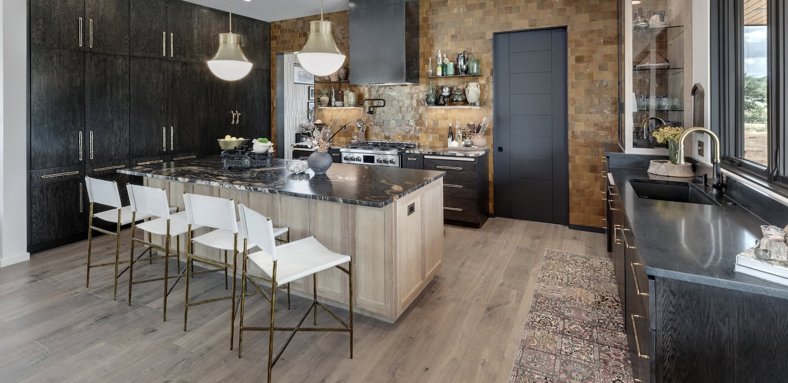 Modern kitchen with earthy materials, wood floors, and soft natural light highlighting texture and detail
