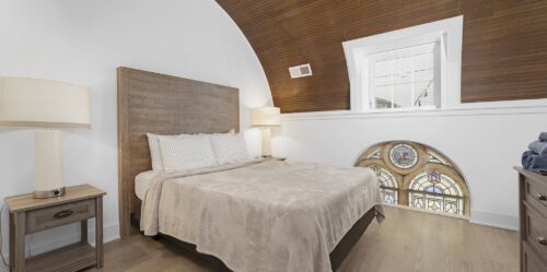Retrospect - Horseshoe; Remodel CLT, Charlotte, NC Bedroom with historic architectural elements and Retrospect Horseshoe flooring