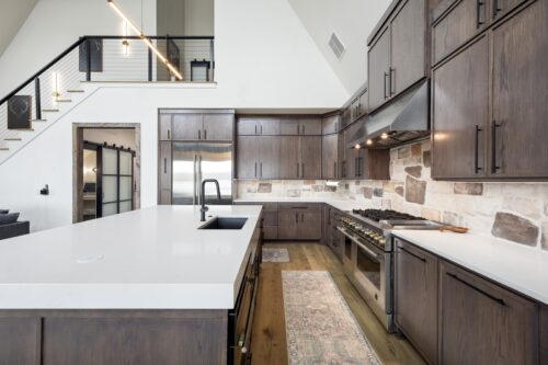 Bright kitchen with contrasting finishes softened by natural-toned flooring