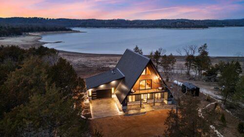 Lakefront A-frame cabin at sunset in Rogers, Arkansas