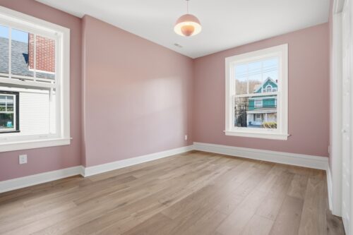Bedroom with blush walls and natural european white oak wood flooring