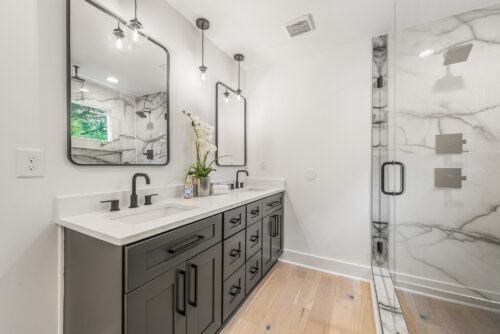 Bathroom interior with natural wood flooring and neutral design