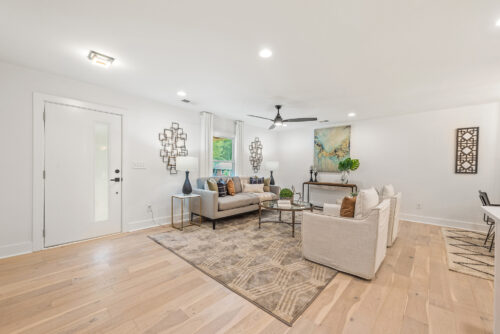Modern living room with natural oak flooring and layered textures