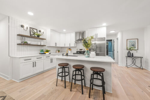 Bright kitchen with hardwood flooring and clean modern finishes