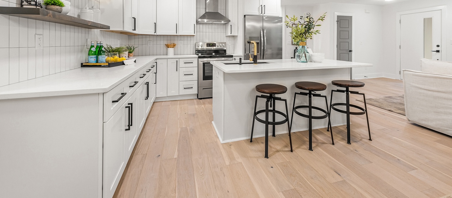 Living room with 1875 wide plank European white oak flooring and natural light
