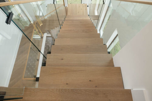 Floating staircase with matching European white oak treads in Sugar Land TX