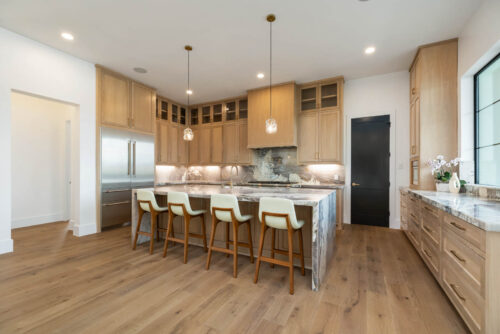 Lakefront kitchen with hardwood floors and clean contemporary design