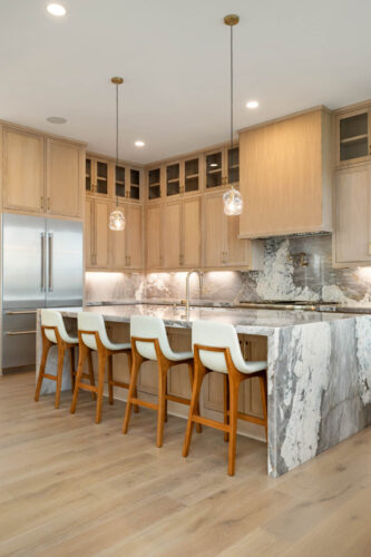 Open kitchen with wood flooring and modern finishes Sugar Land TX