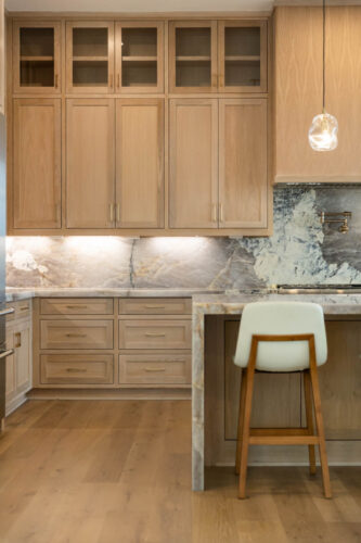 Kitchen with European white oak flooring and large island in Sugar Land TX