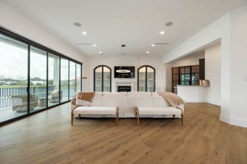 Open living space with European white oak flooring and natural light in Riverstone