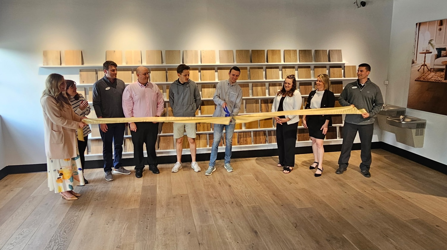 Pittsburgh showroom grand opening event featuring Real Wood Floors team, chamber representatives, and community guests