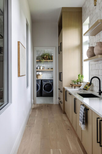 Modern butlers pantry and laundry room with oak flooring and natural materials Naples FL