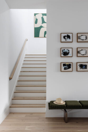 Coastal home with Floormade hardwood staircase and neutral palette