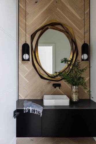 Herringbone accent wall in coastal Naples, FL bathroom