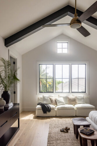 Light-filled bedroom with Silvian hardwood flooring in Naples Florida home
