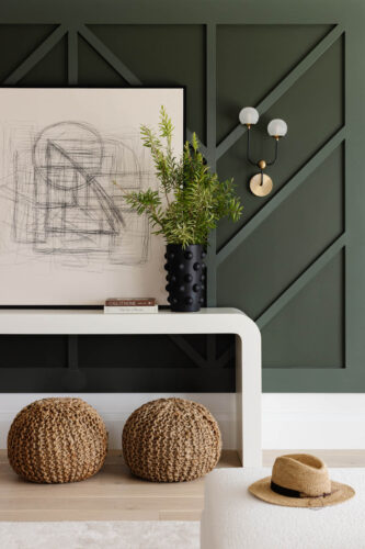 Deep green accent wall with geometric detail and organic stylings