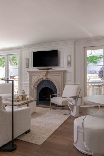 Curated transitional living room with wide plank white oak flooring and architectural details.