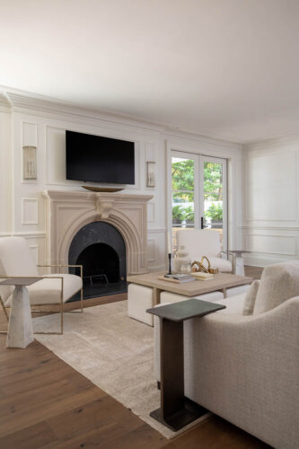 Curated transitional living room with wide plank white oak flooring and architectural details.