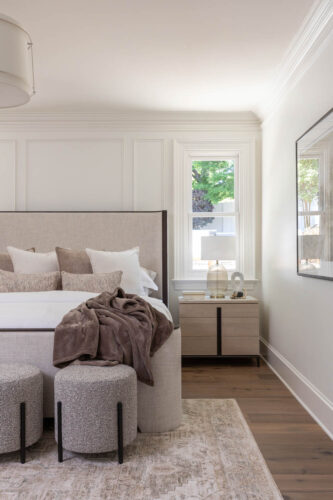 Bright bedroom designed with matte finish engineered hardwood flooring and natural light.