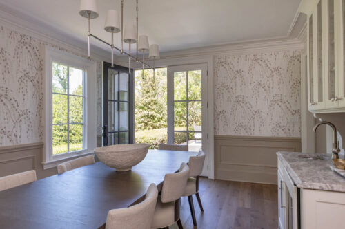 Transitional dining room with custom millwork and matte finish engineered hardwood flooring.