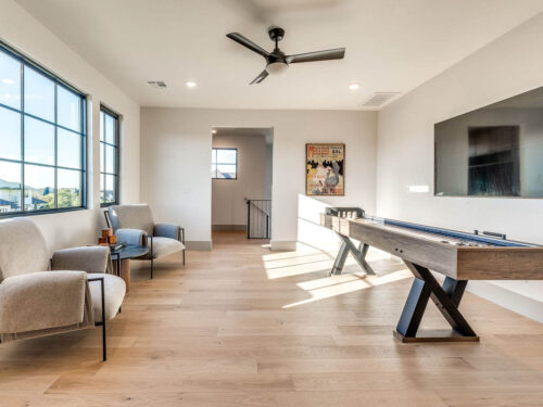 Game room with European White Oak flooring, pool table, and layered wood accents