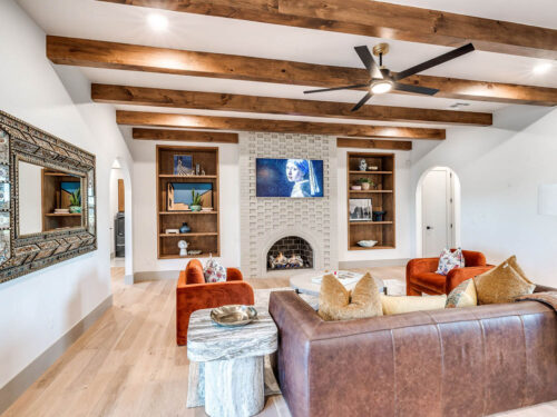 1875 Battersea oak flooring creating contrast beneath dark architectural ceiling beams