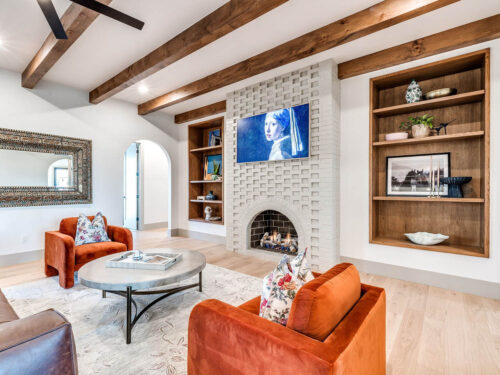 New build living room with pale oak flooring, natural wood accents, and abundant daylight