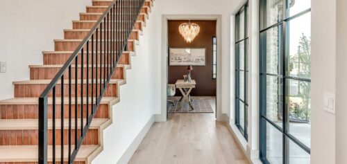 Custom FloorMade wood staircase with colorful tile risers beside light European White Oak flooring