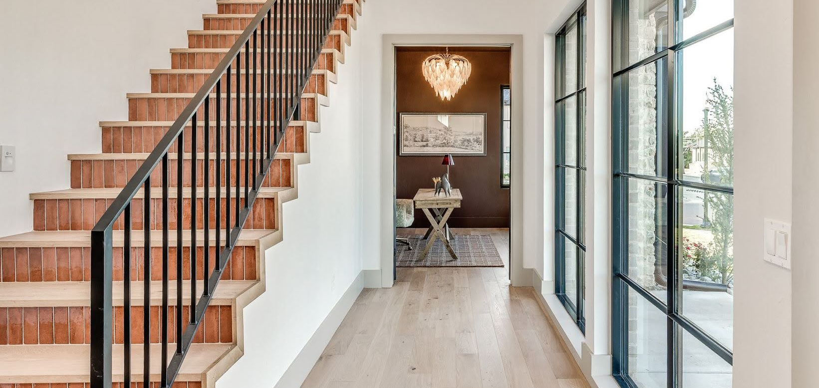 1875 – Battersea Hero Custom FloorMade wood staircase with colorful tile risers beside light European White Oak flooring