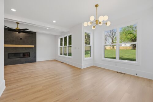 Retrospect Lily Pond flooring paired with a contemporary charcoal fireplace