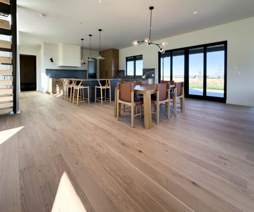 Dining room with Real Wood Floors wide plank European white oak flooring in a Bozeman, Montana home