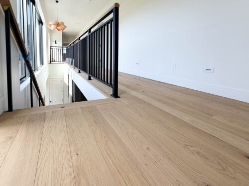 Bozeman hallway featuring Real Wood Floors wide plank European white oak flooring.