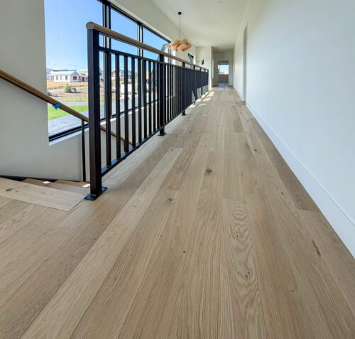 European white oak flooring by Real Wood Floors in a hallway of a Bozeman, Montana home.