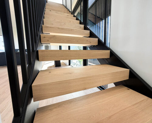 Staircase featuring FloorMade floating treads in a Bozeman home with Real Wood Floors European white oak flooring.