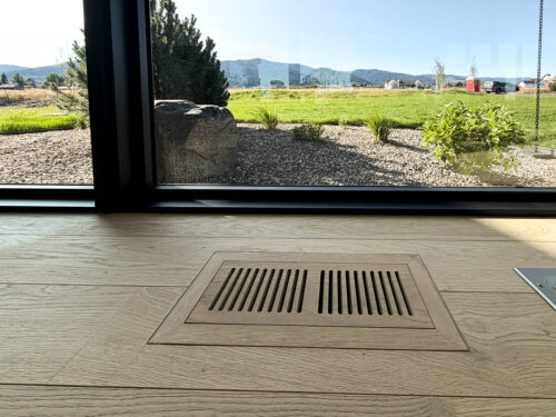FloorMade vent set into wide plank European white oak flooring by Real Wood Floors in Bozeman.