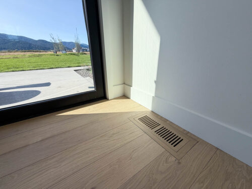FloorMade vent integrated into a Real Wood Floors wide plank European white oak installation in Bozeman.